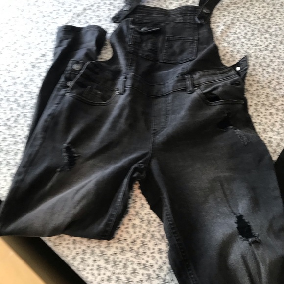 Skinny leg farmer jean one piece with rips on legs - Picture 2 of 5